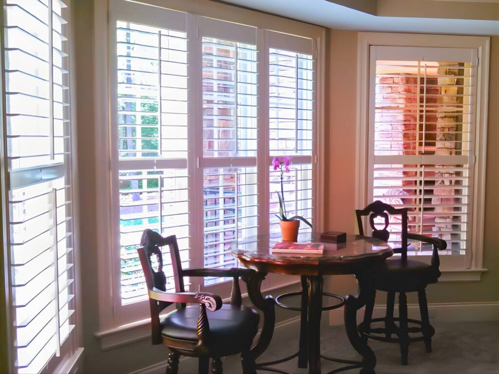 Southern Accent custom shutters on a bay window near Clayton, NC at Southern Accent Shutters & Blinds